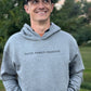 Man wearing a faith based hoodie with "faith, family, freedom" printed across the front.
