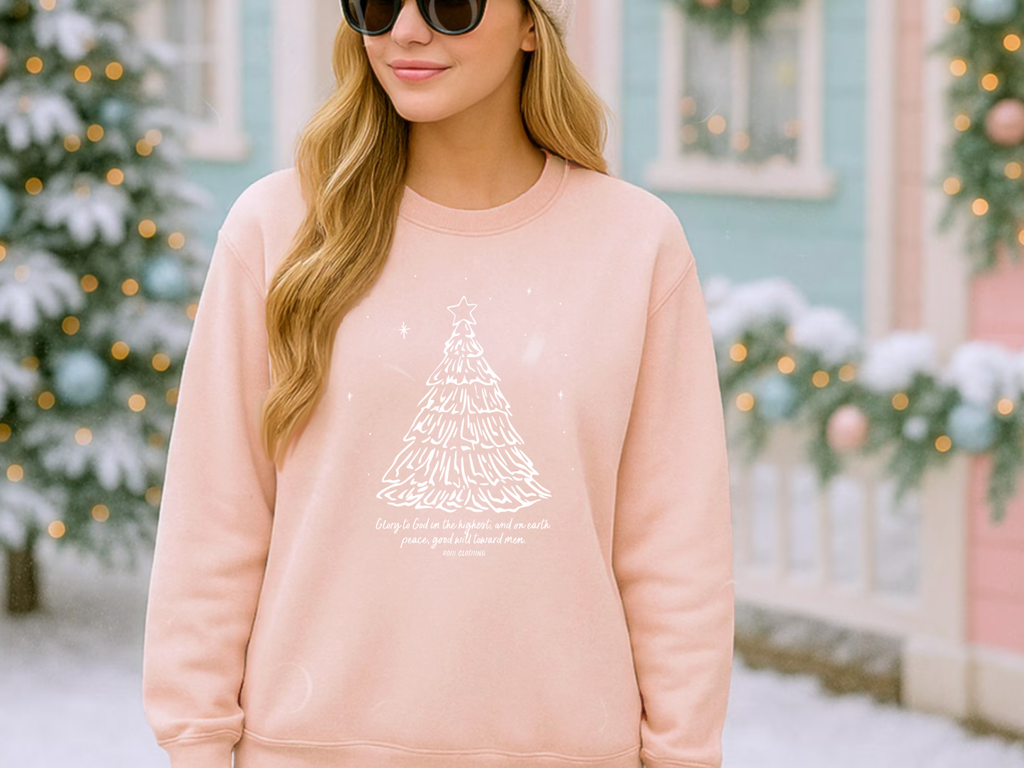 faith based blush pink Christian Christmas sweatshirt with a hand drawn tree design in a Christmas scene